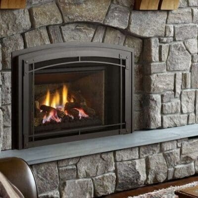 Cozy stone fireplace with a warm fire burning inside.