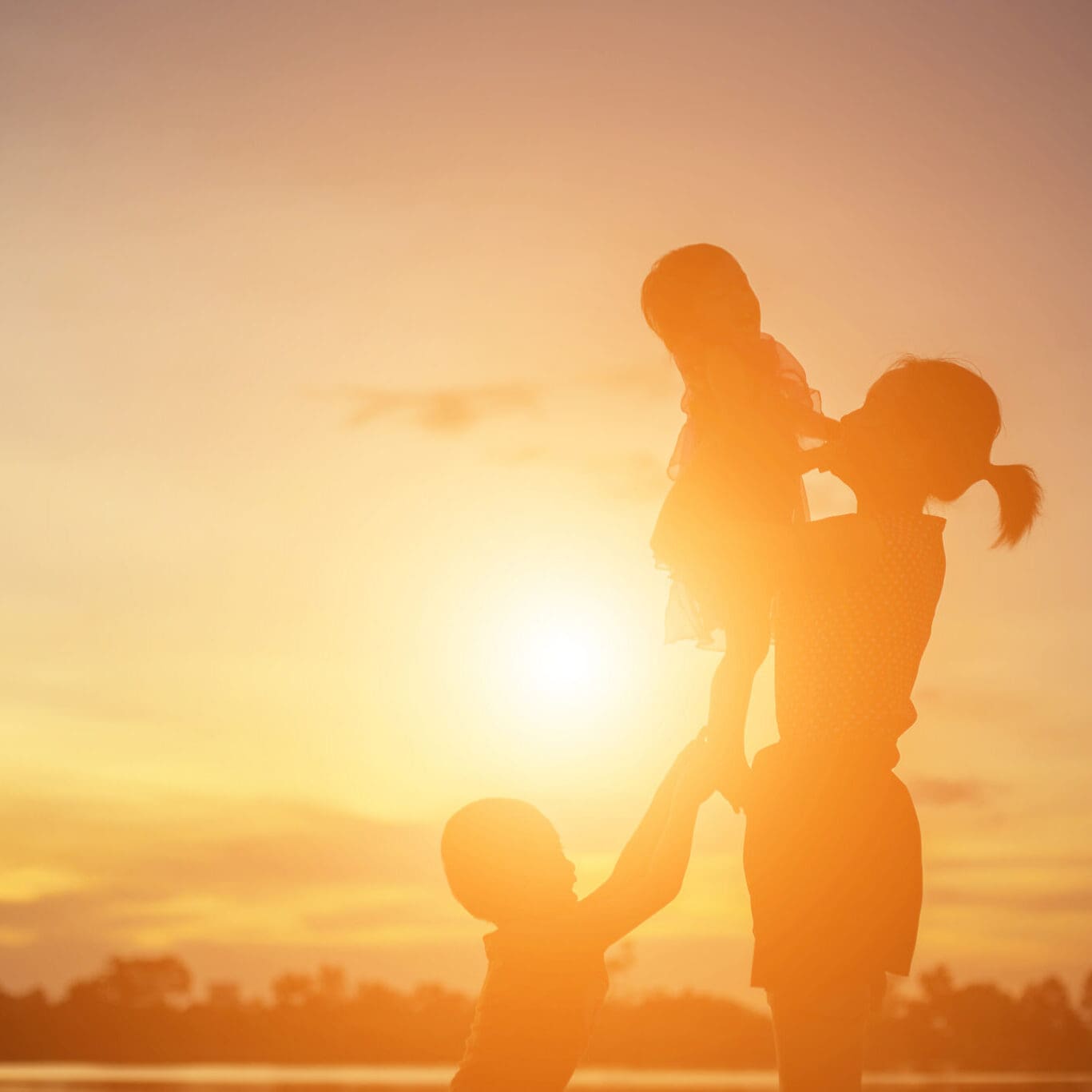 mother and 2 children in the sun